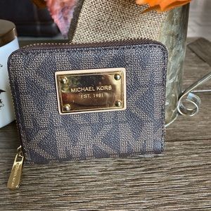 Michael Kors Jet Set Brown PVC zip around wallet.